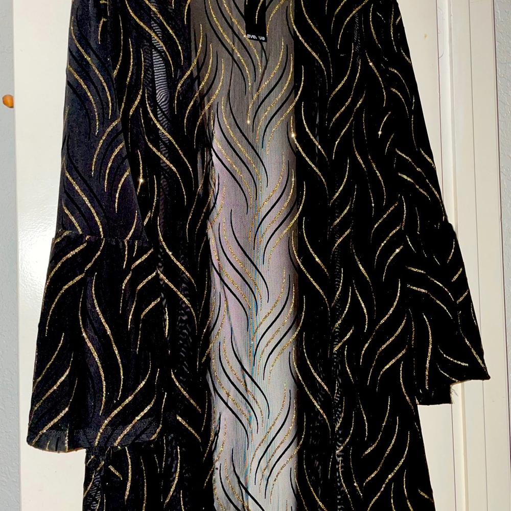 Jacket Black Semi-Sheer with silver and gold accents.